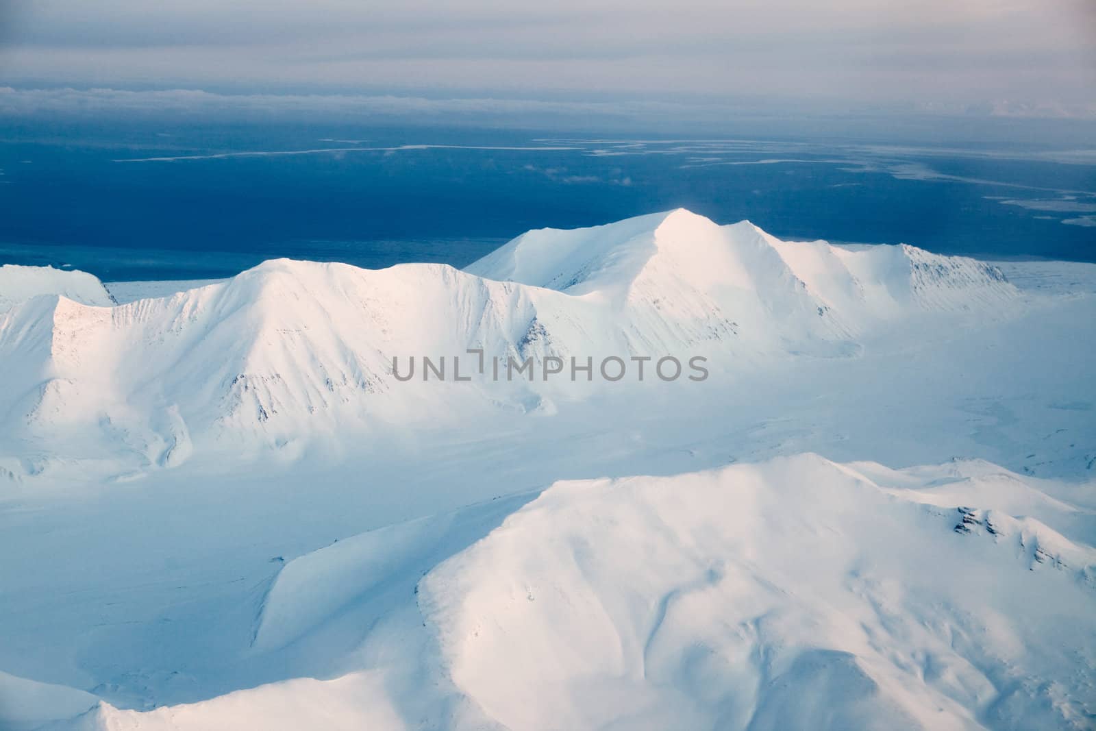 A mountain landscape filled with snow, Svalbard, Norway