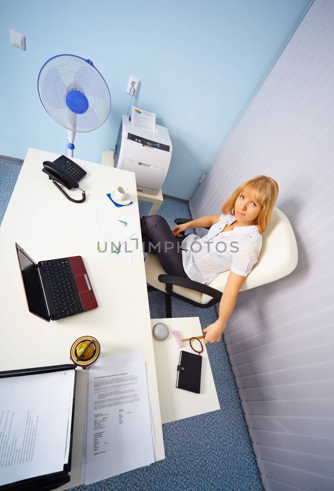 A pretty young secretary on workplace in the office