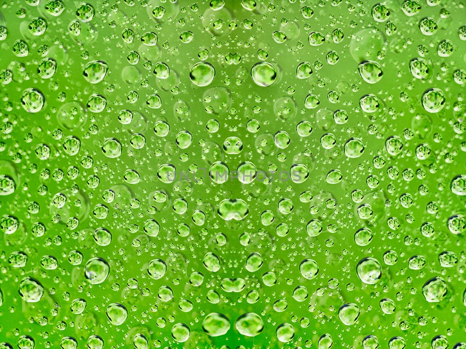 Abstract background - a drop of water on a green