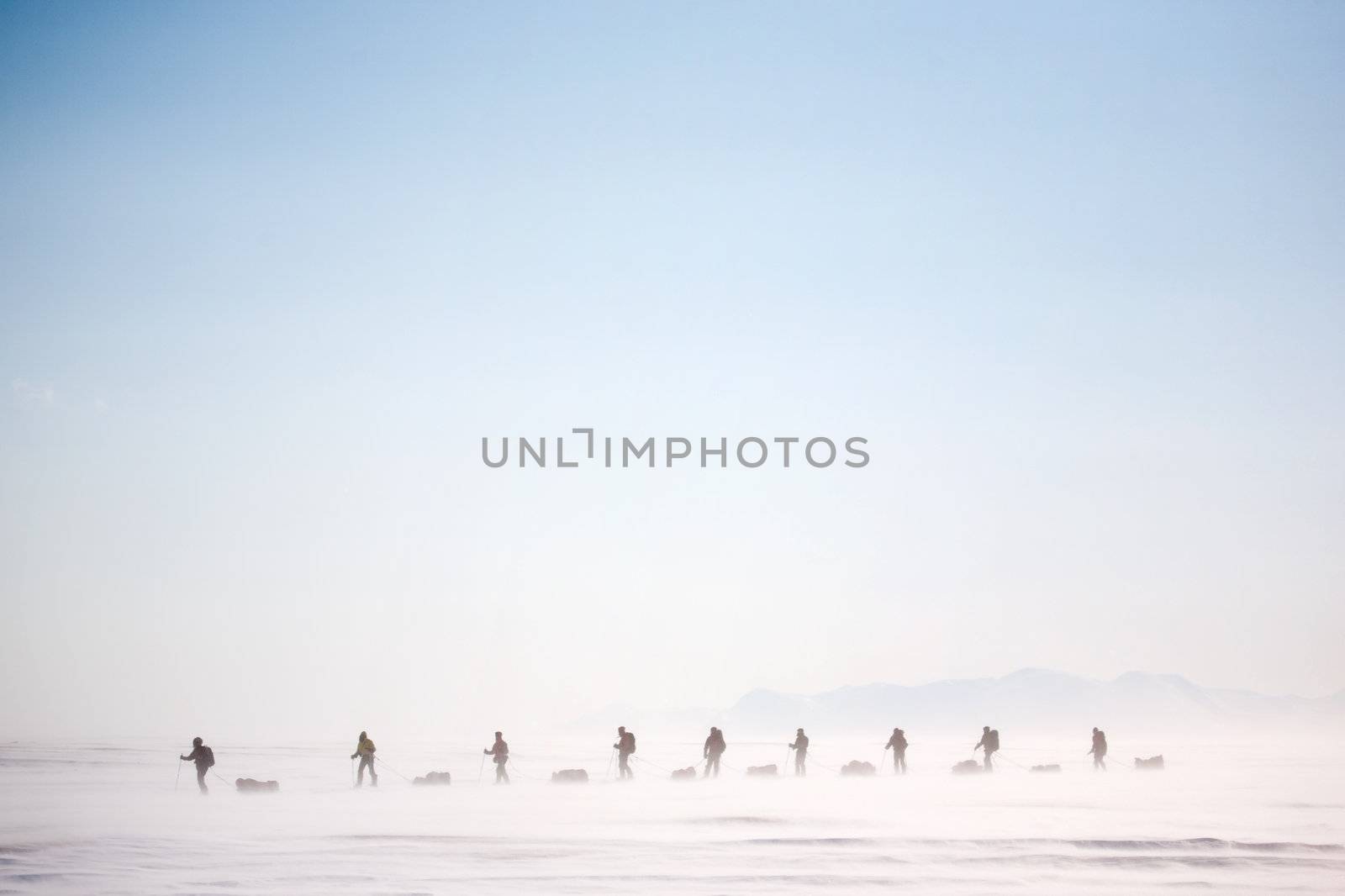 A group of people on a winter expedition in a snow storm