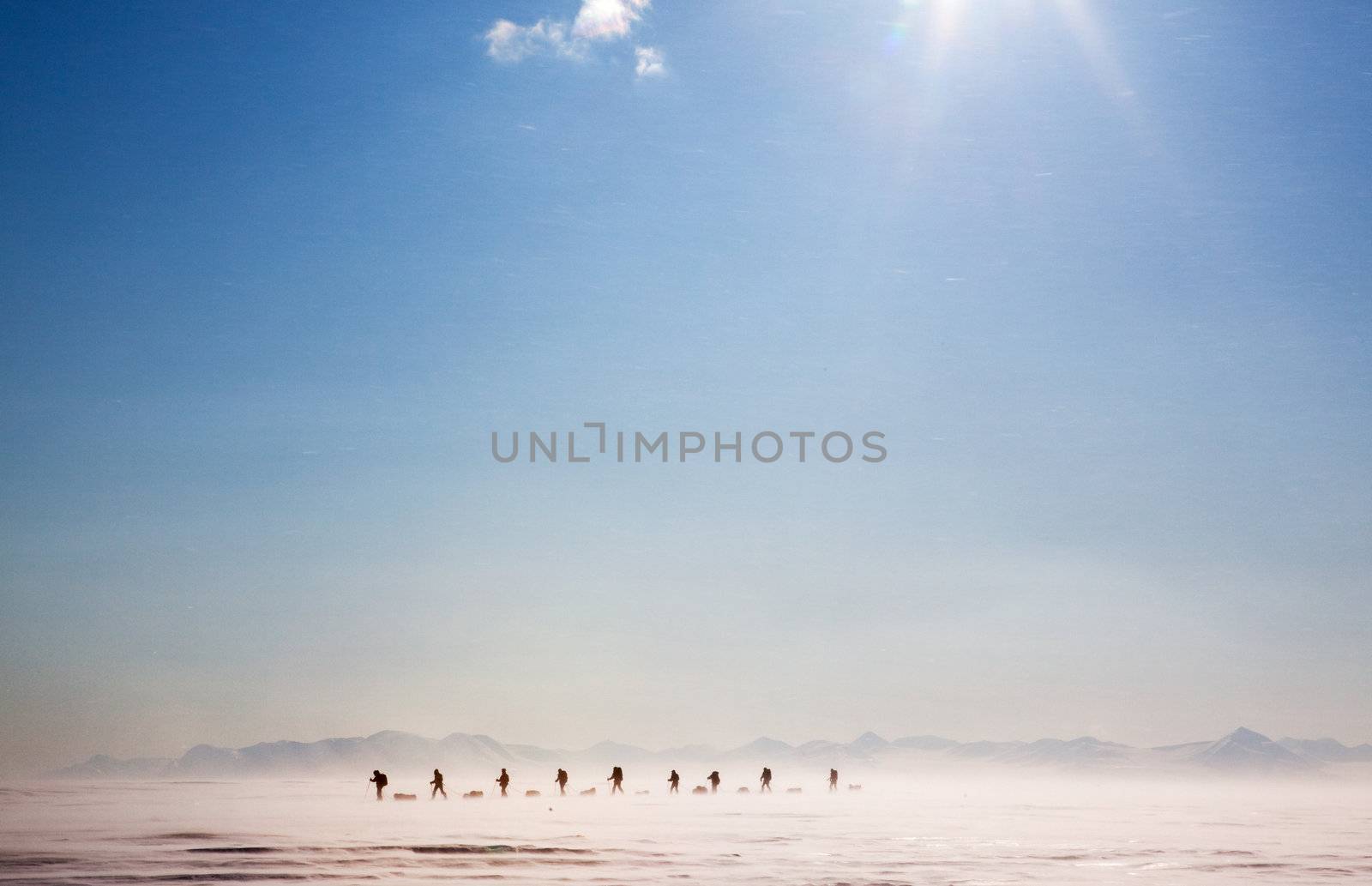 A group of people on a polar expedition in a snow storm