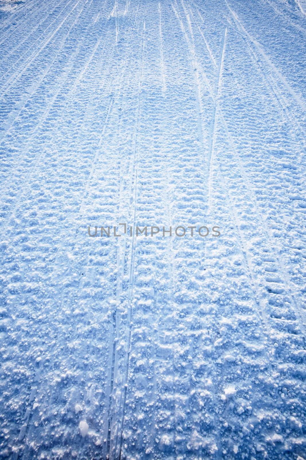 Snow texture background from snowmobile tracks