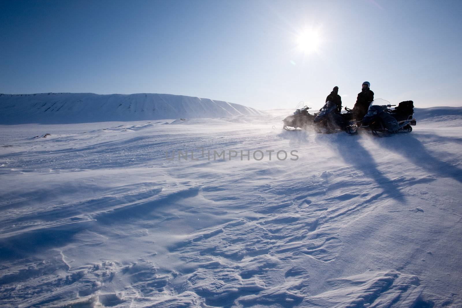 Travelling in a very cold winter landscape with blowing snow