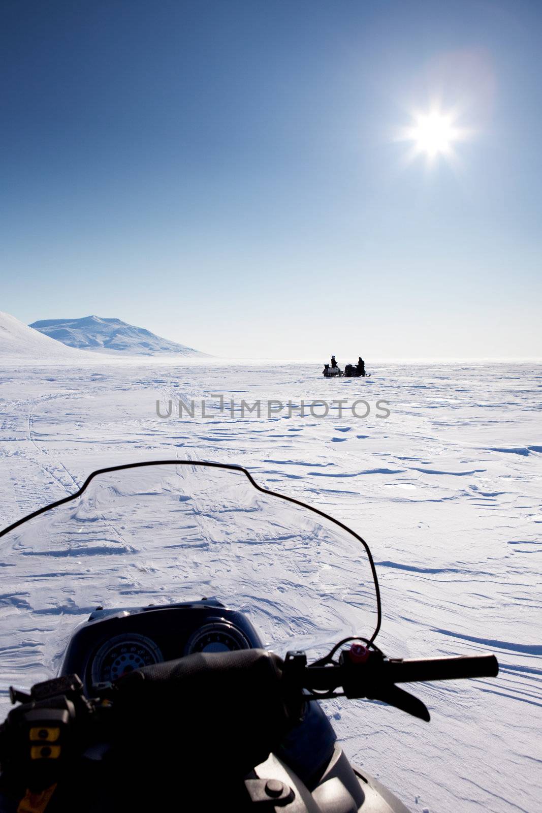 Snowmobile in Winter Landscape by leaf