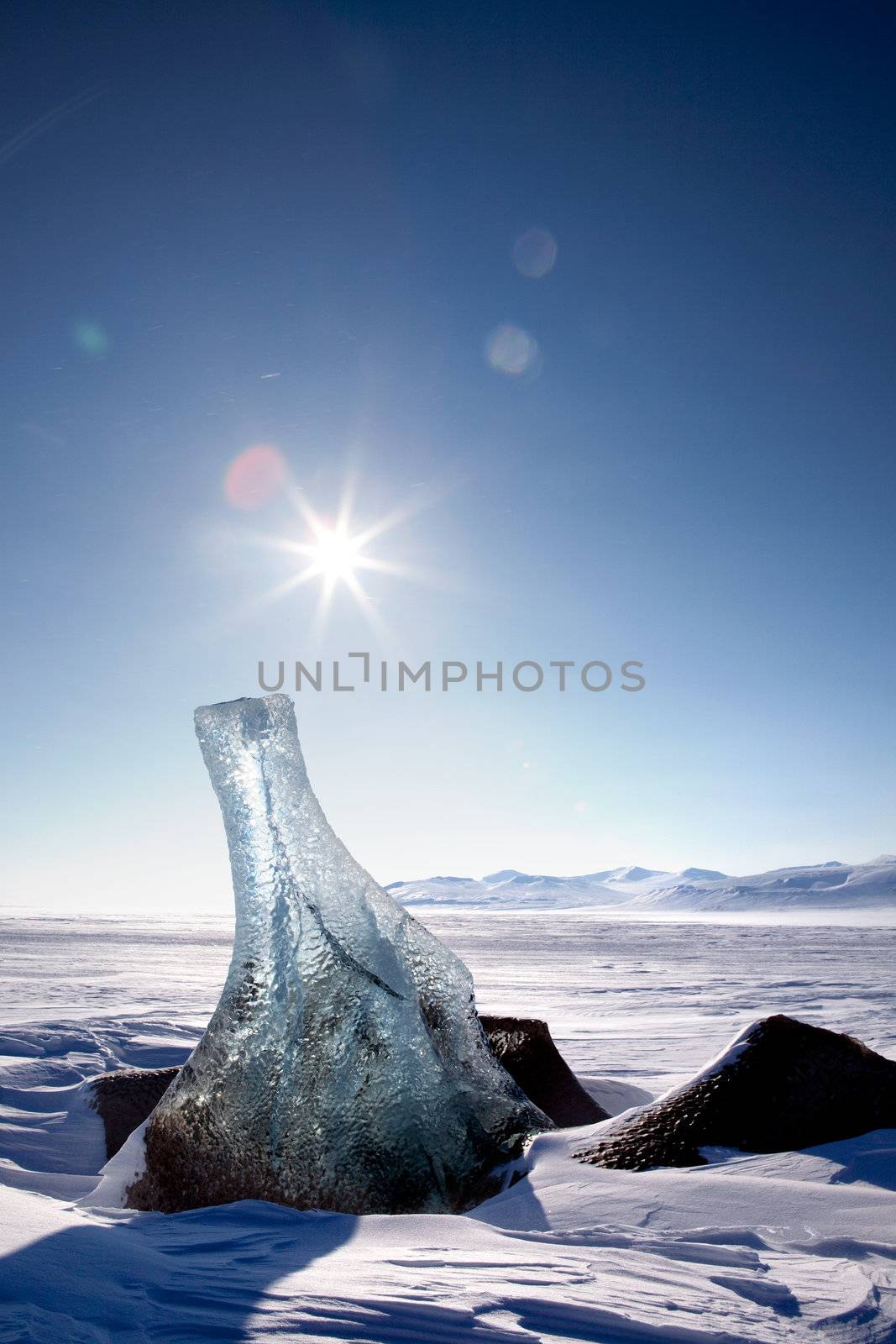 A piece of glacier ice sticking out of the frozen ocean, Spitsbergen, Svalbard, Norway