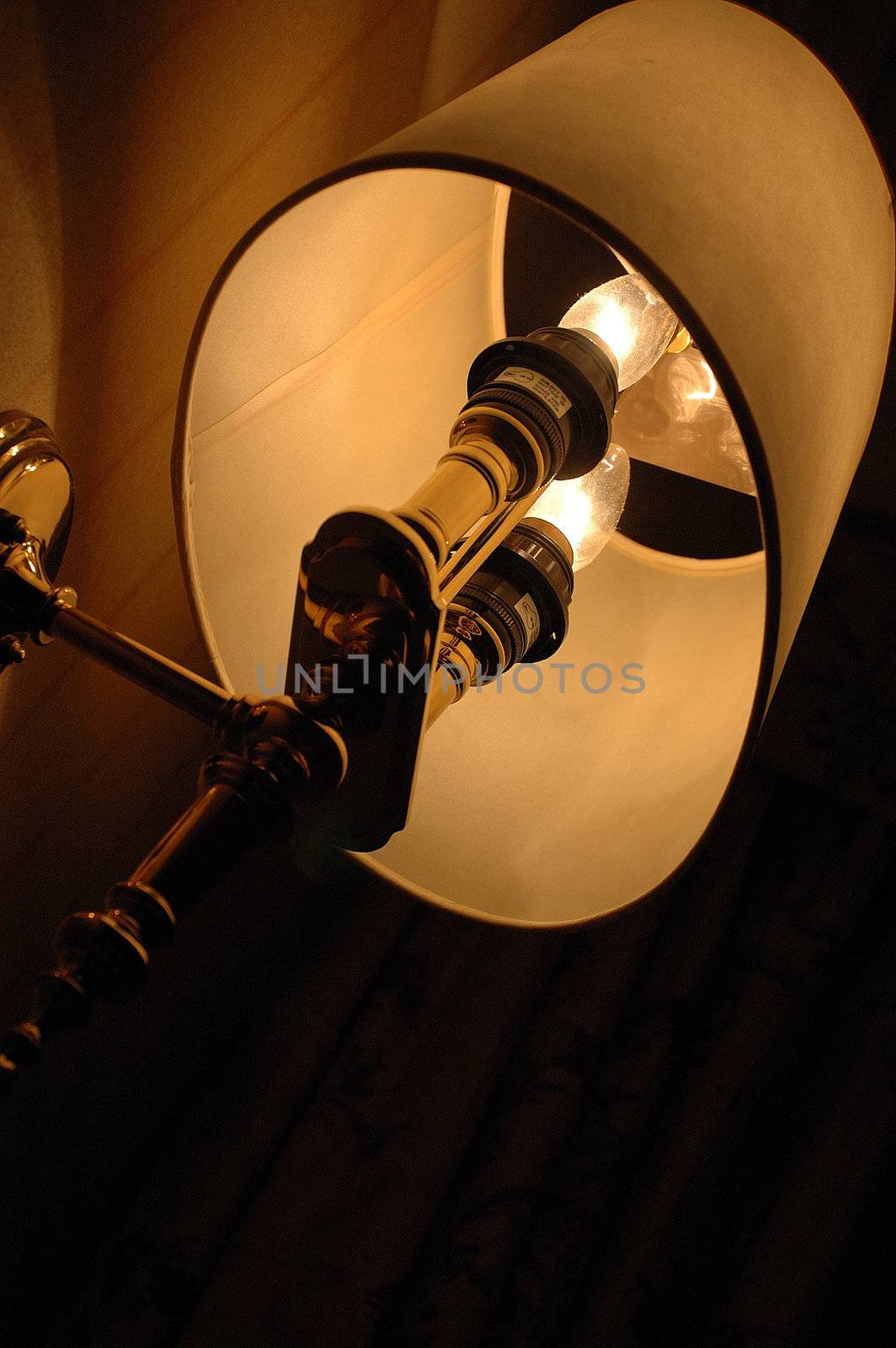 A room decorative lamp casting light and shadows on a wall