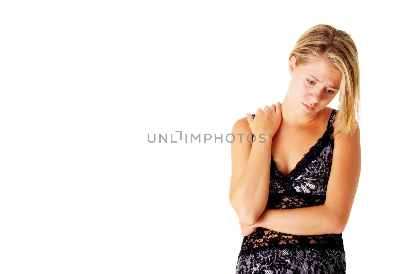 Sad girl in a dress, against a white background.