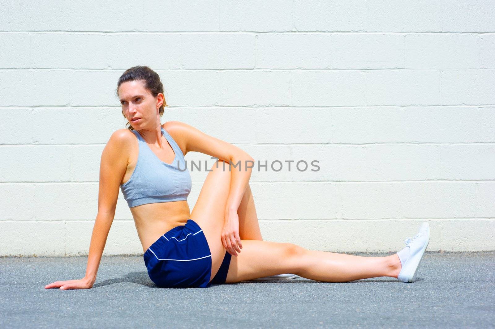 Mature woman working out in an urban setting, from a complete set of photos.