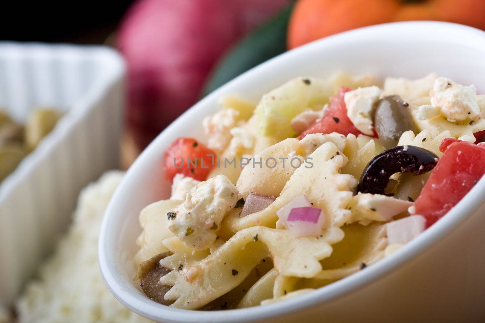 a fresh greek bow-tie pasta salad served cold