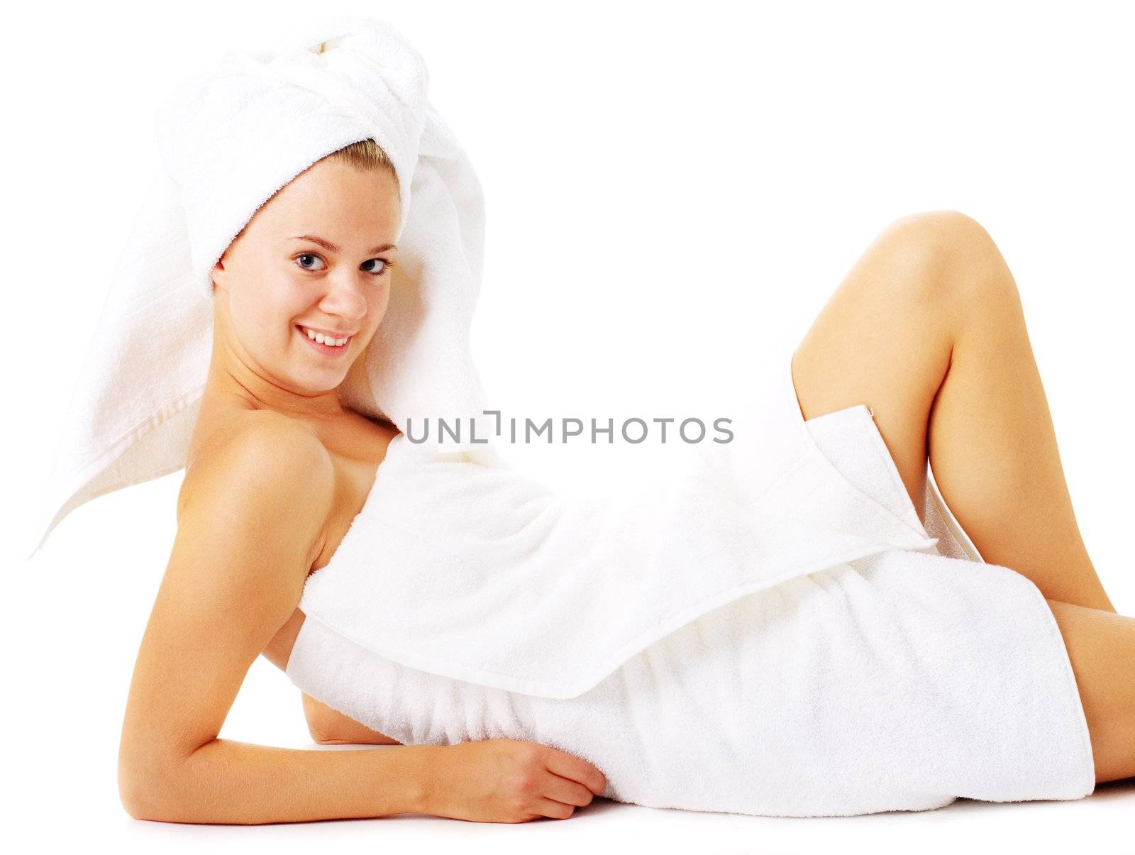 Beautiful young spa woman on white, from a complete series of photos.