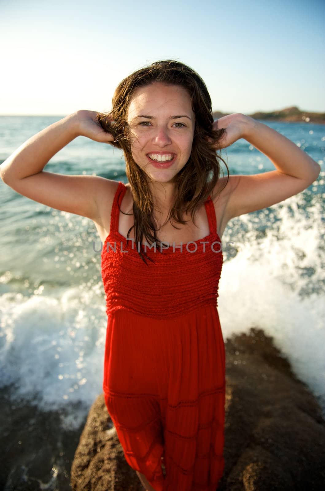 Beauty woman relaxing on the beach by swimnews