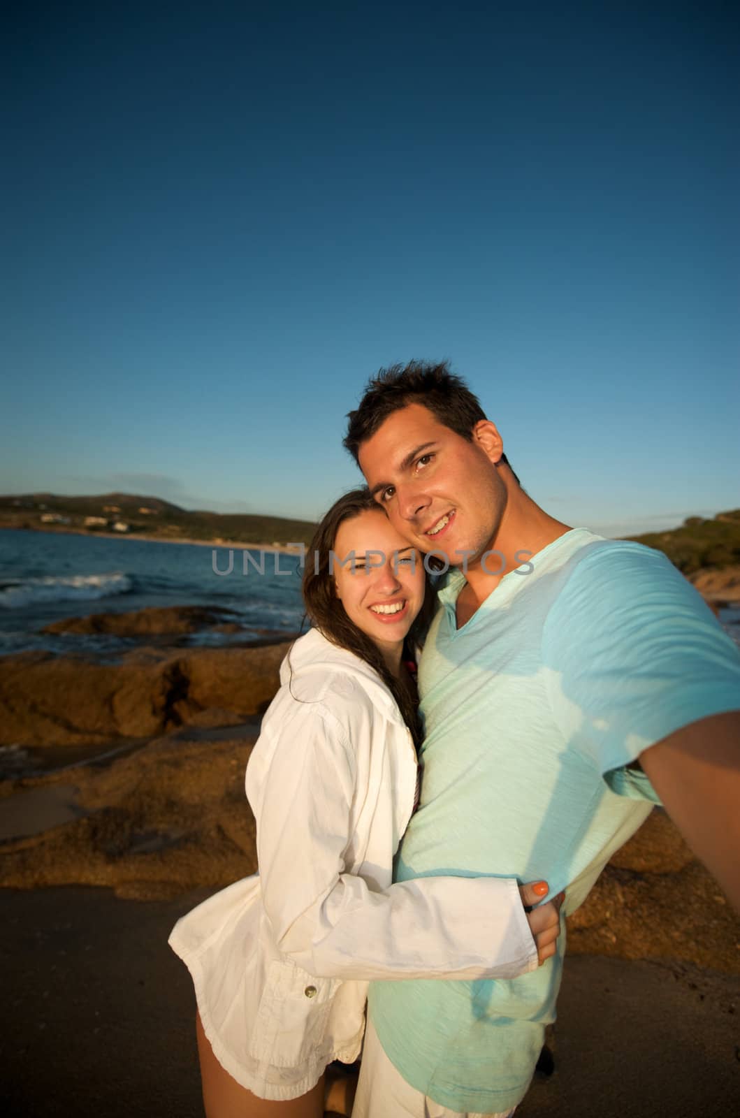 Love couple on the beach by swimnews