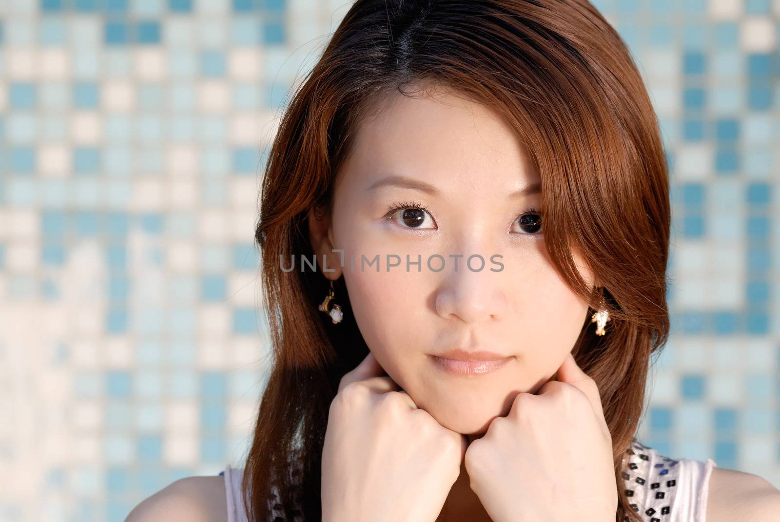 beautiful Asian lady in front of mosaic and watch by elwynn