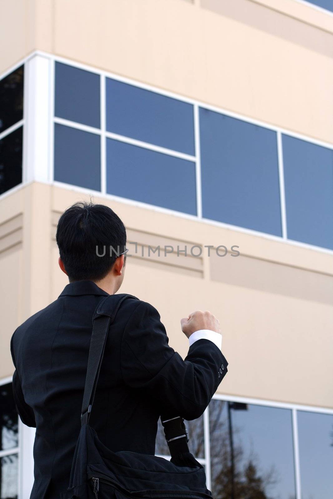 Businessman with fist up, happy and successful symbol