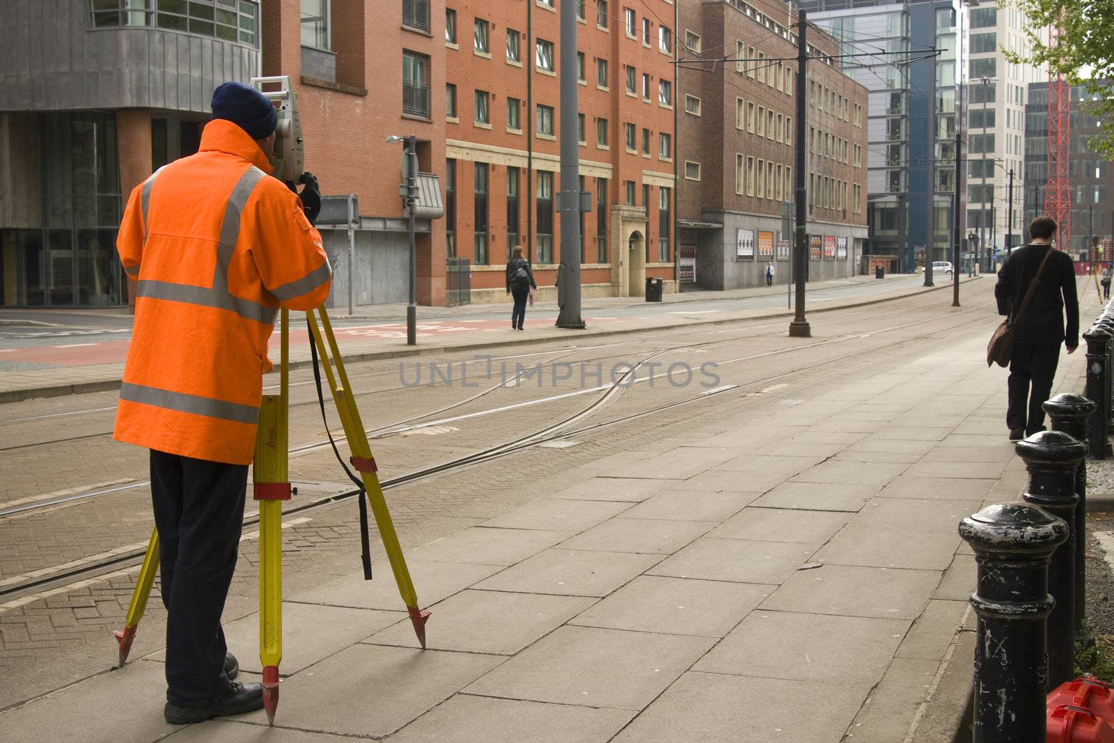 Surveyor taking measure in Manchester, UK