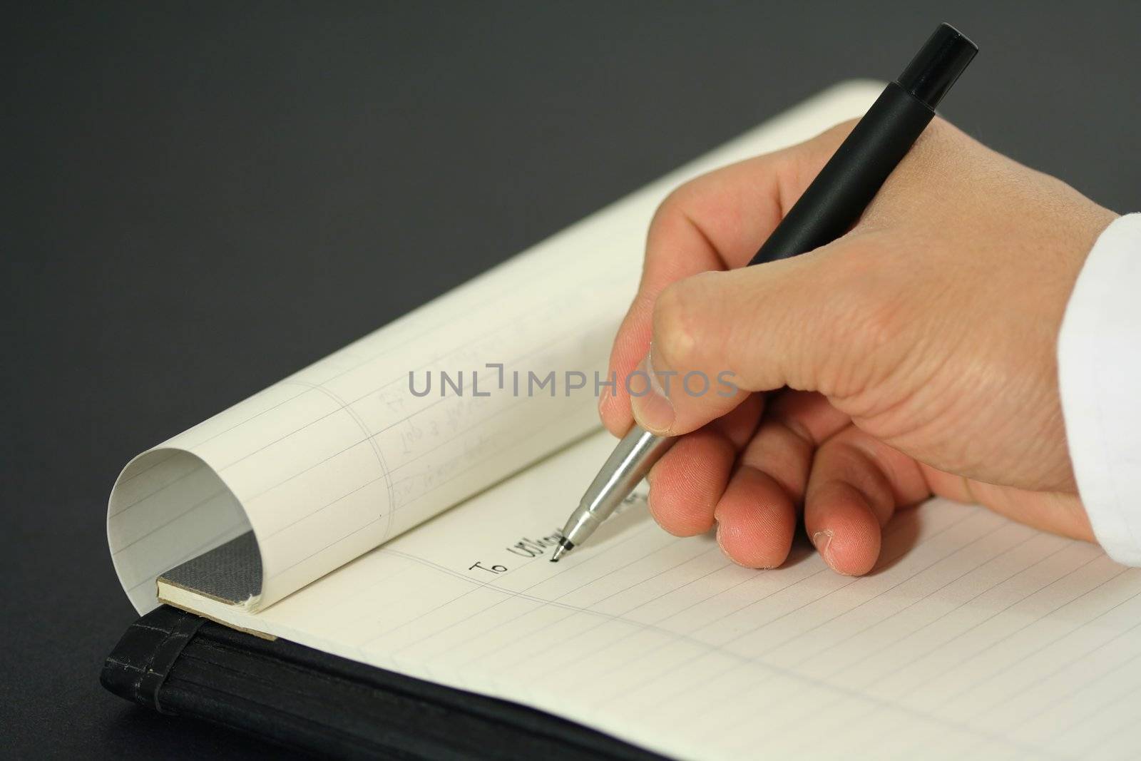 A businessman writing a business letter