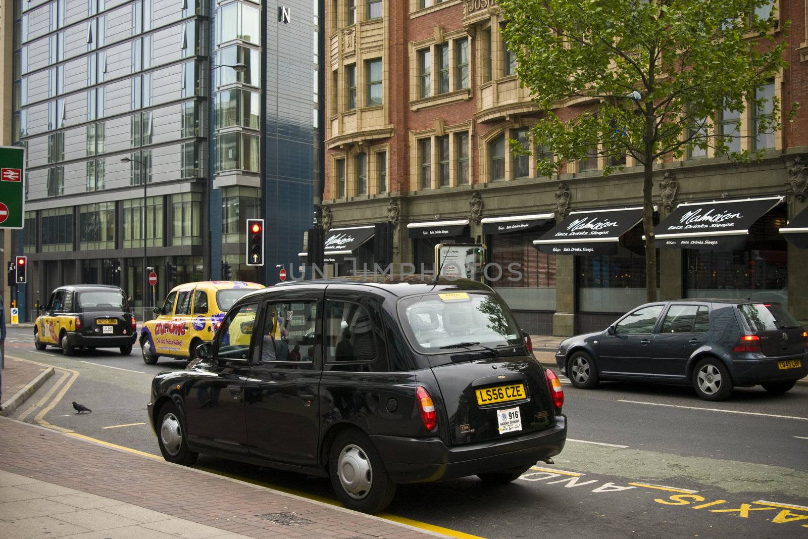 Hackney cabs on a street of Manchester