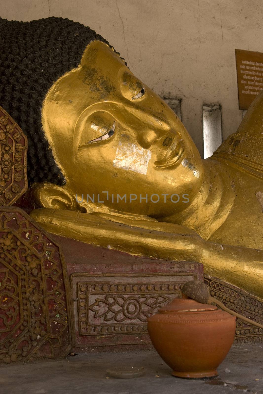 Reclining buddha head by cvail73