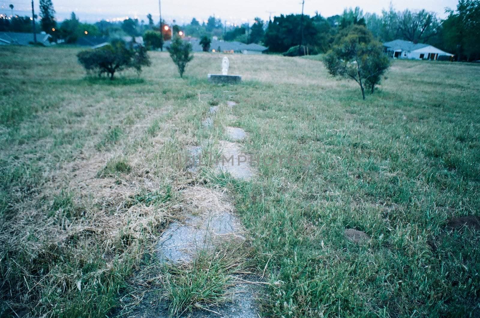 An old foot path leading to a statue of Mary