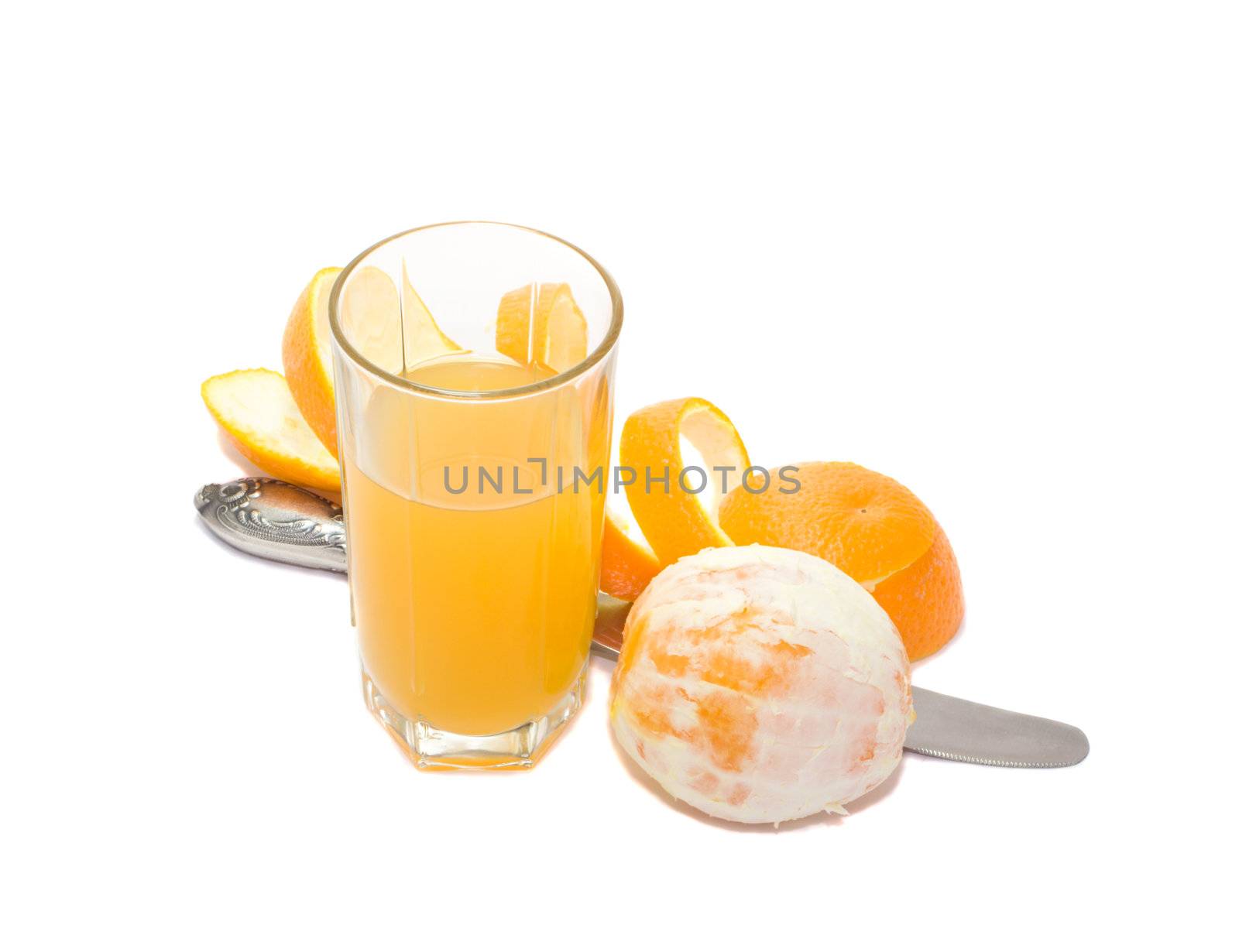 glass with orange juice and knife and orange and orange skin, isolated on white