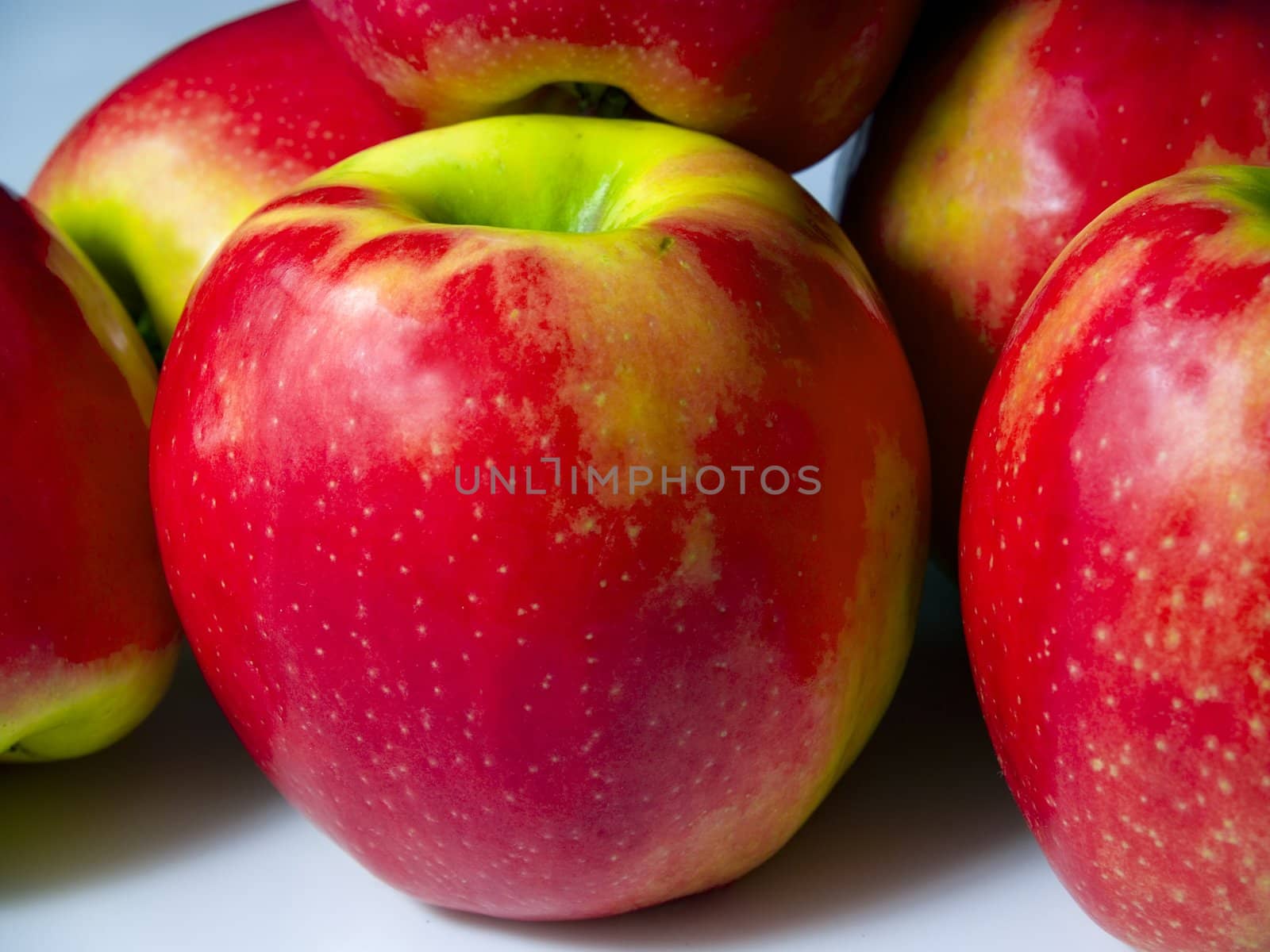 A small pile of fresh green and red apples