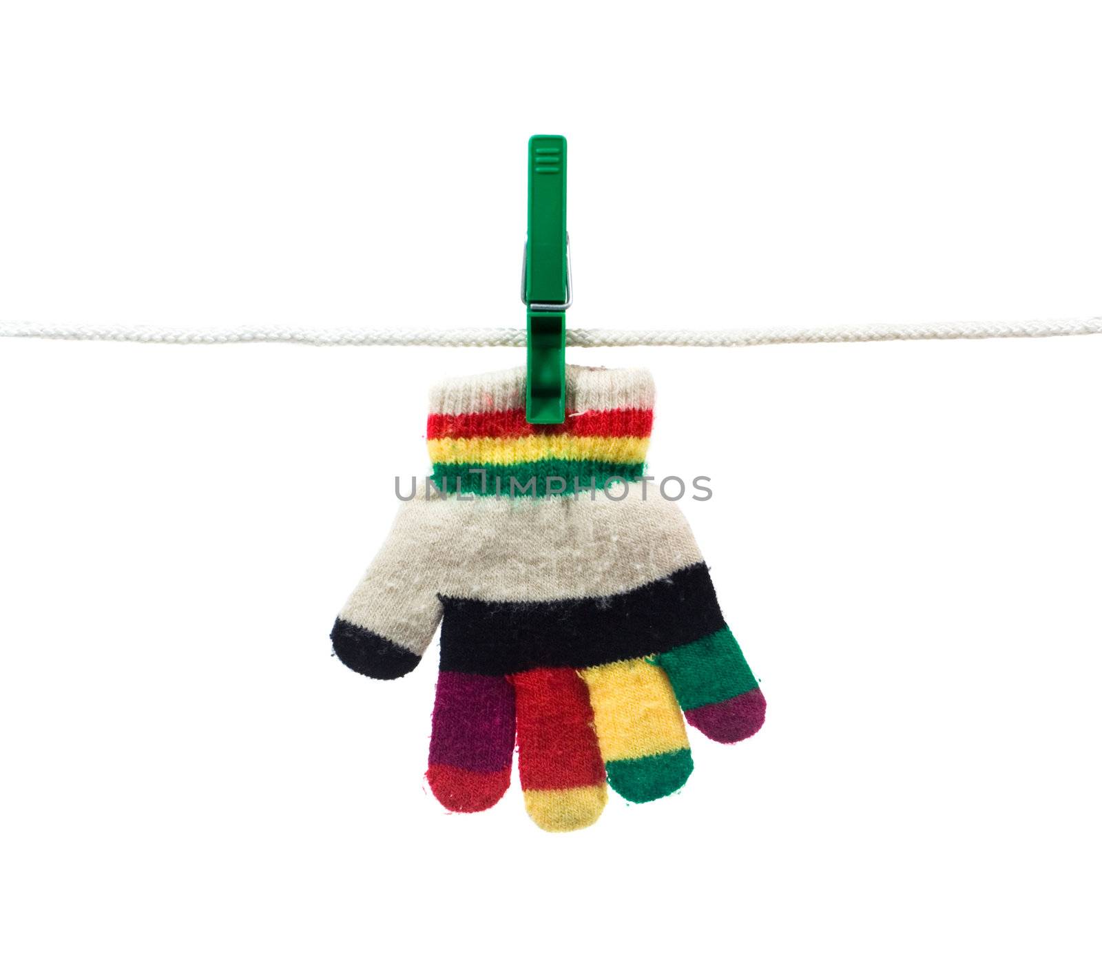 multi colour kid glove on clothes line isolated on white