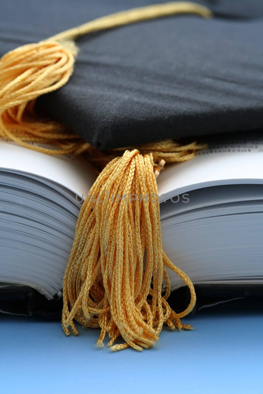 Graduation cap and textbooks