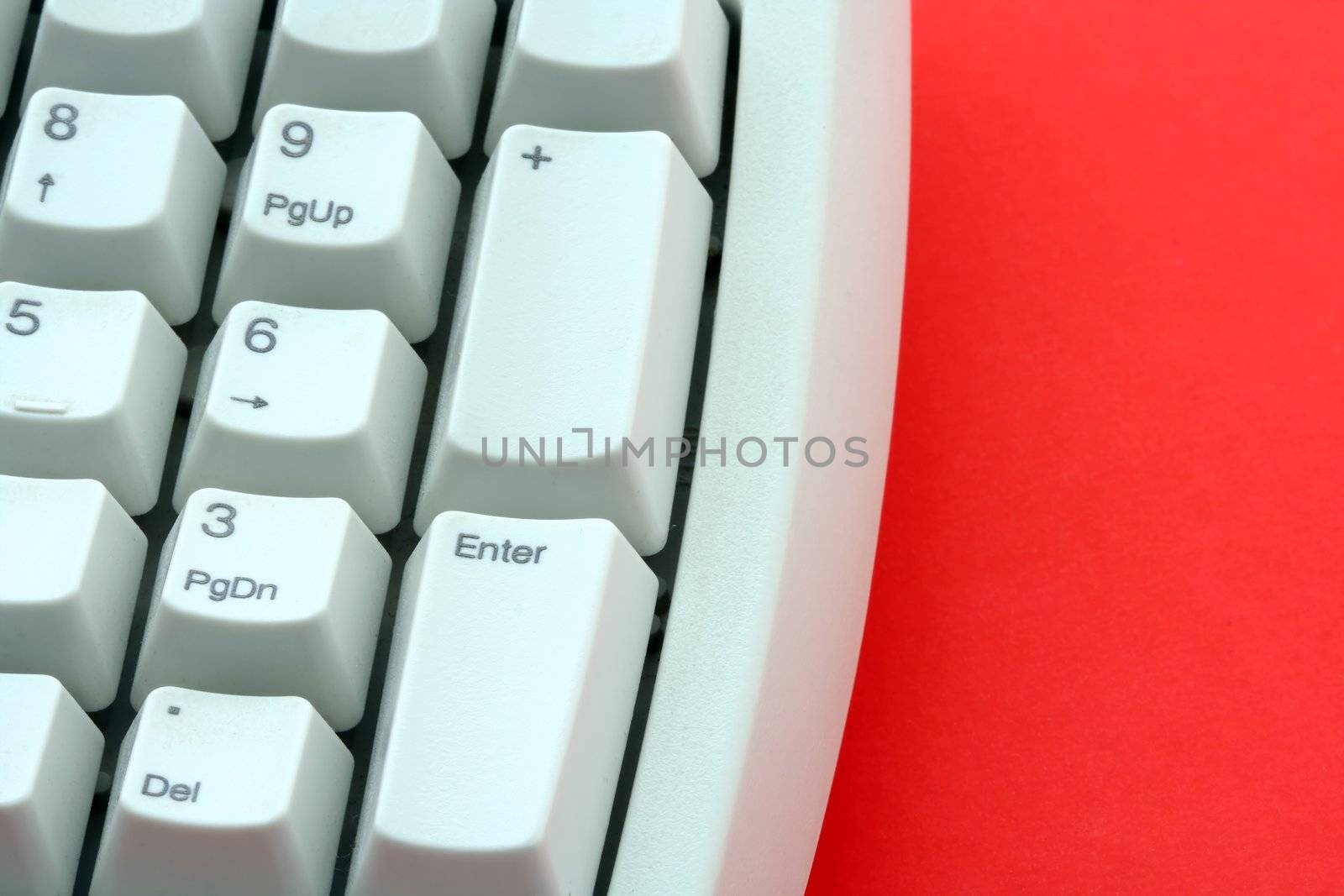 Computer keyboard on red