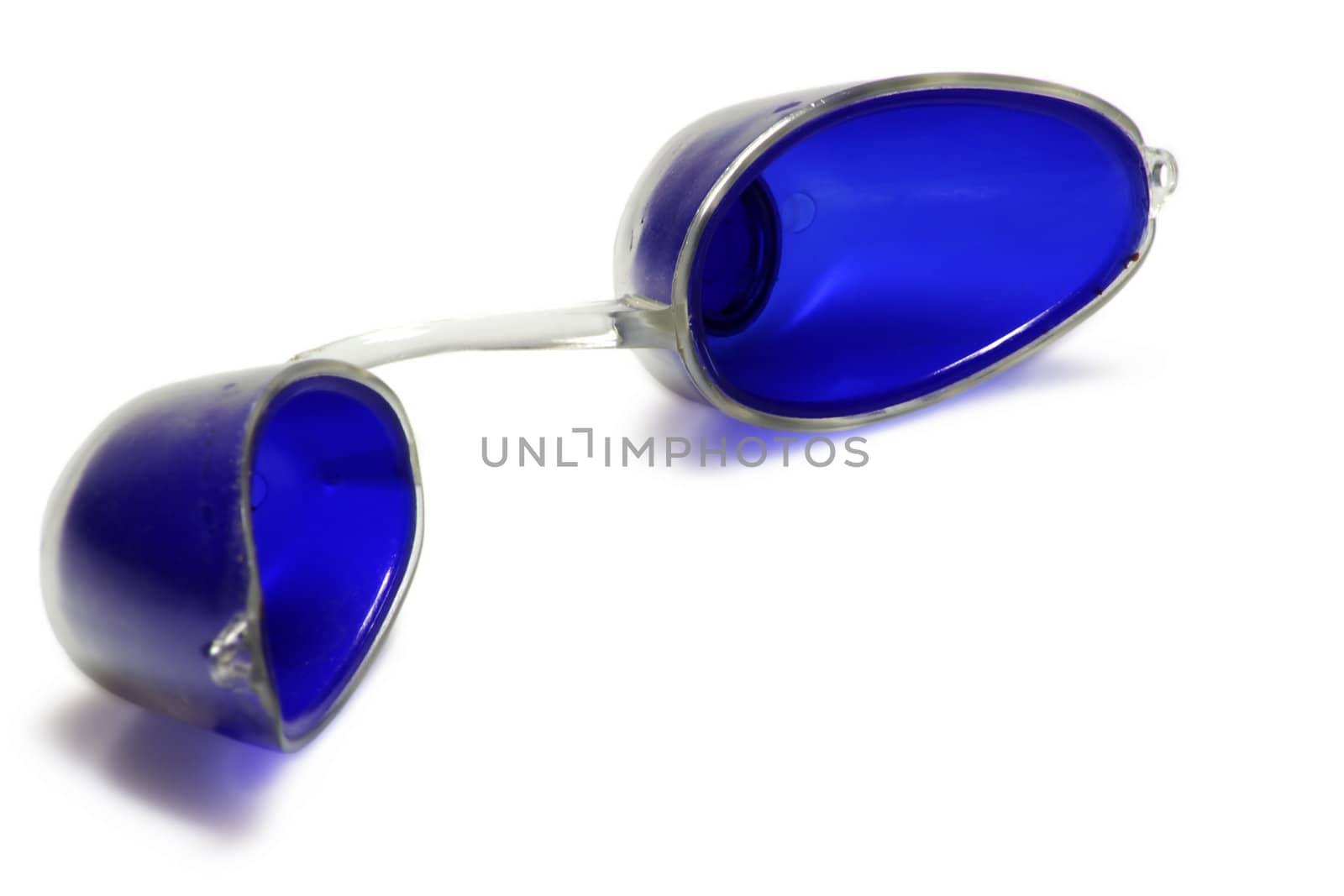 Special plastic goggles for use in a solarium. They cover the smallest possible area: the eyes only. Isolated on white.