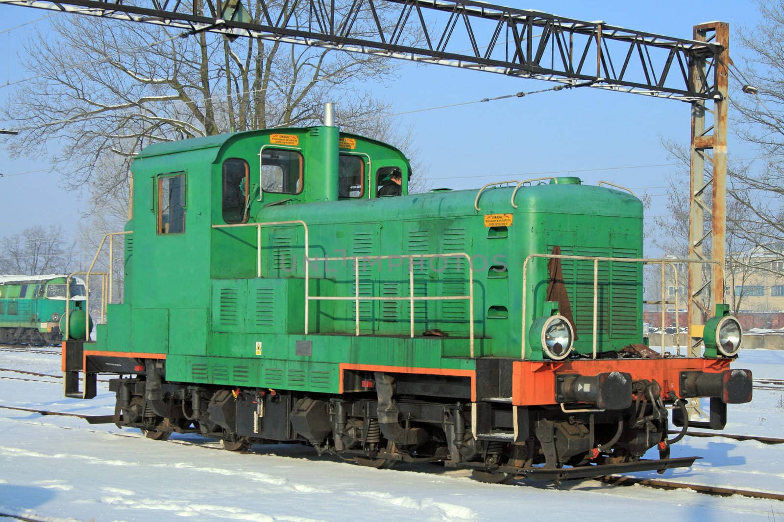 Portrait of a green diesel locomotive
