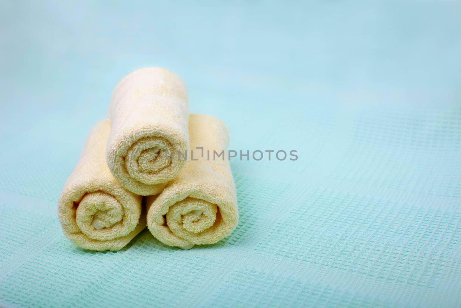 Ivory Spa towels on a blue background