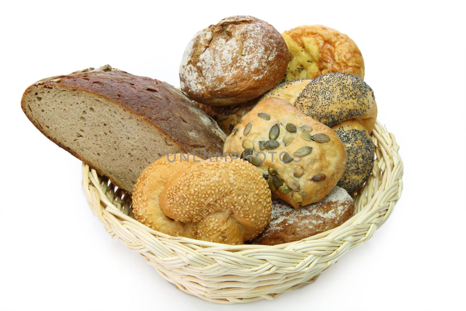 Bread basket with delicious bread rolls on white background