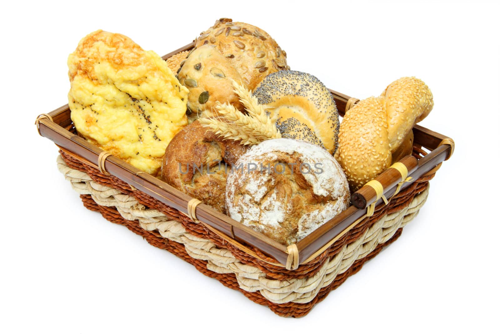 Bread basket with delicious bread rolls on white background