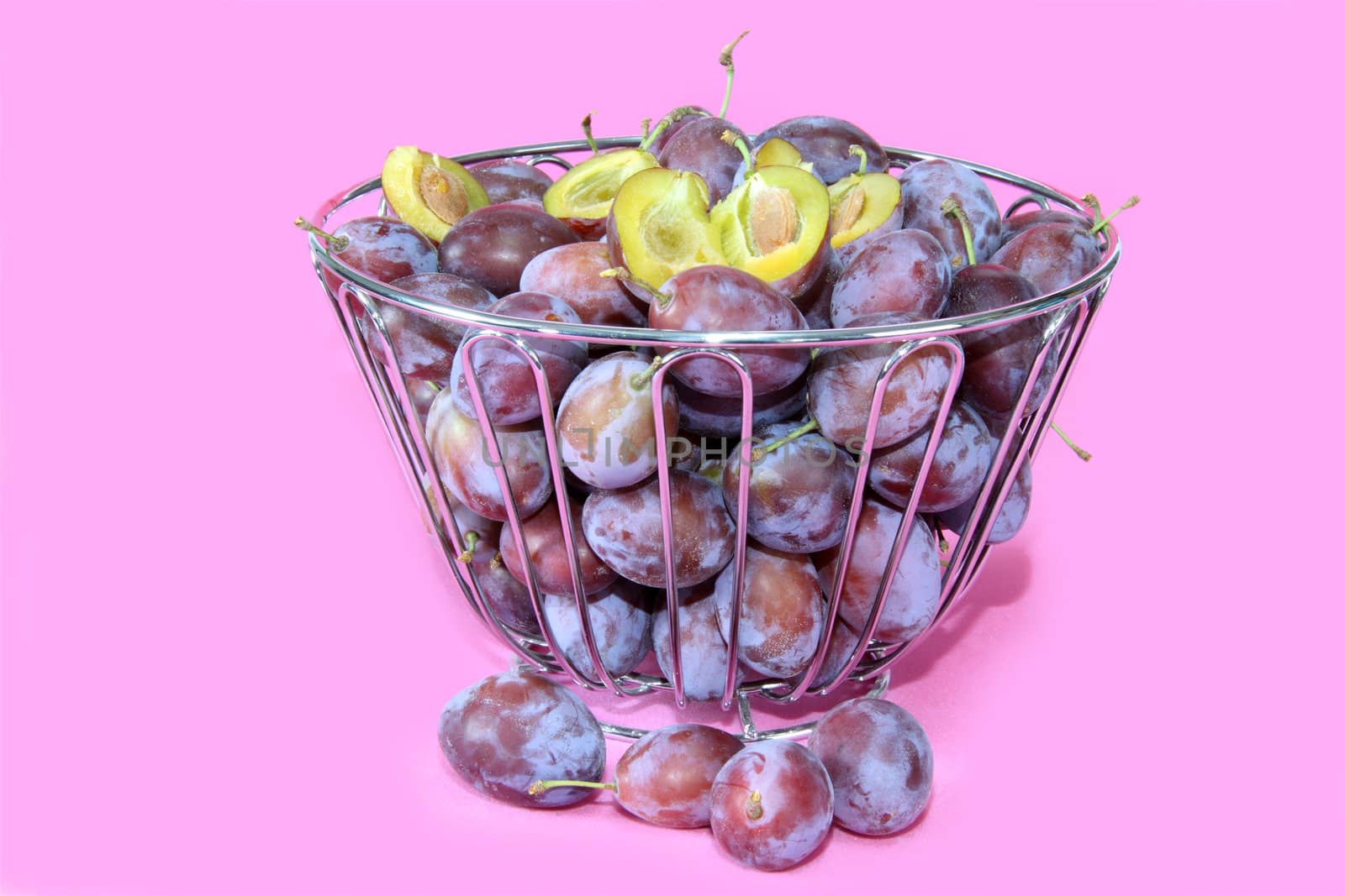 Fresh plums in a bowl. Shot in studio.