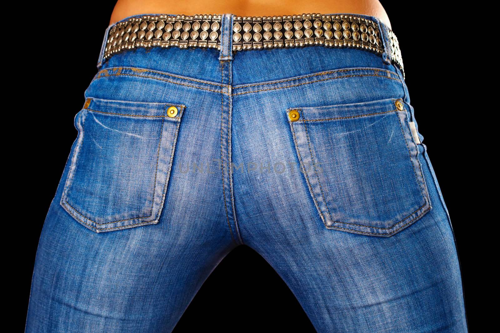 Female ass dressed in jeans on black by pzaxe