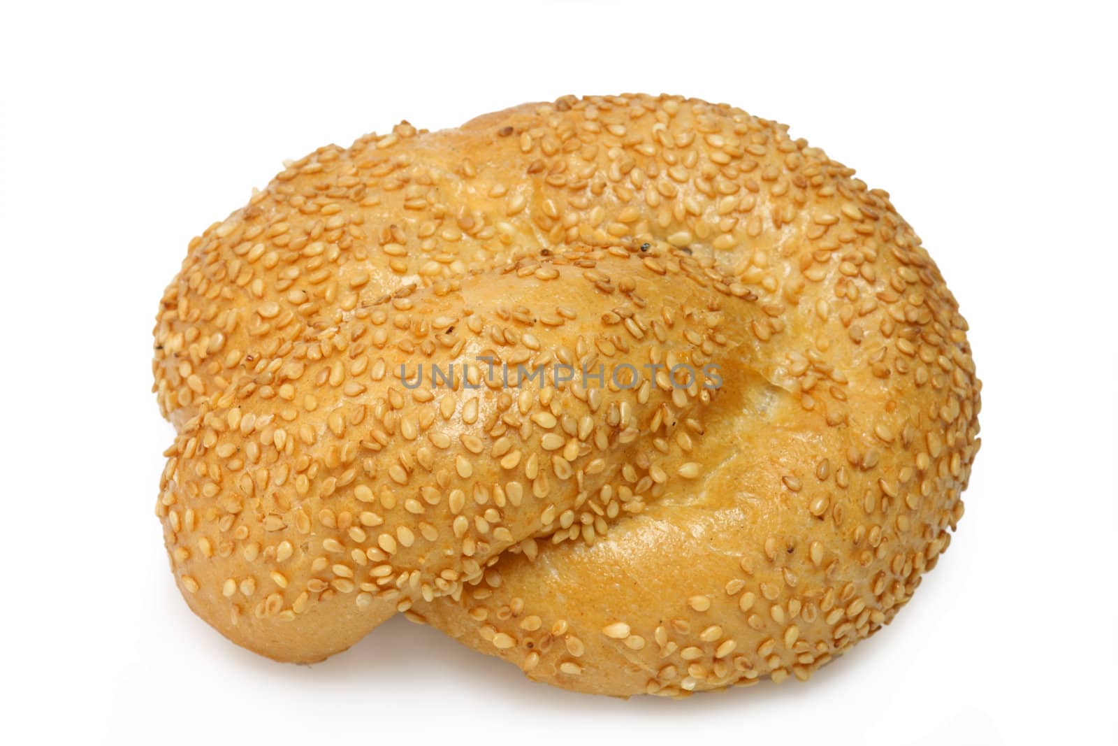 Bread roll with sesame on bright background