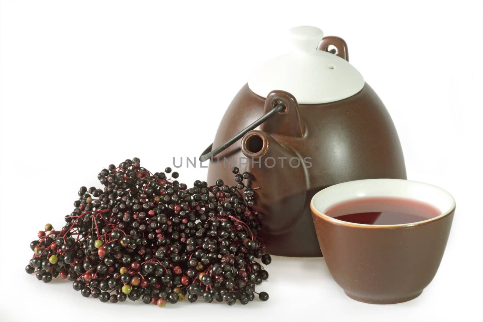 Closeup from tea elder with fresh fruits. Shot in studio.