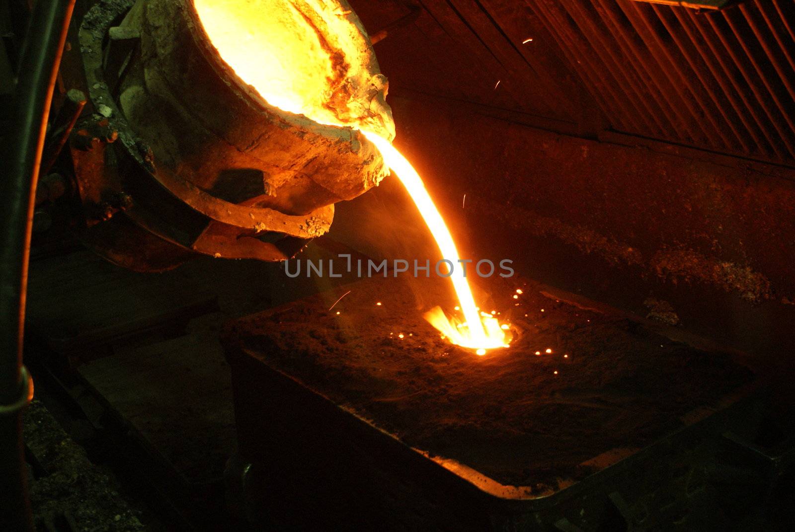A metal casting into a form on a foundry