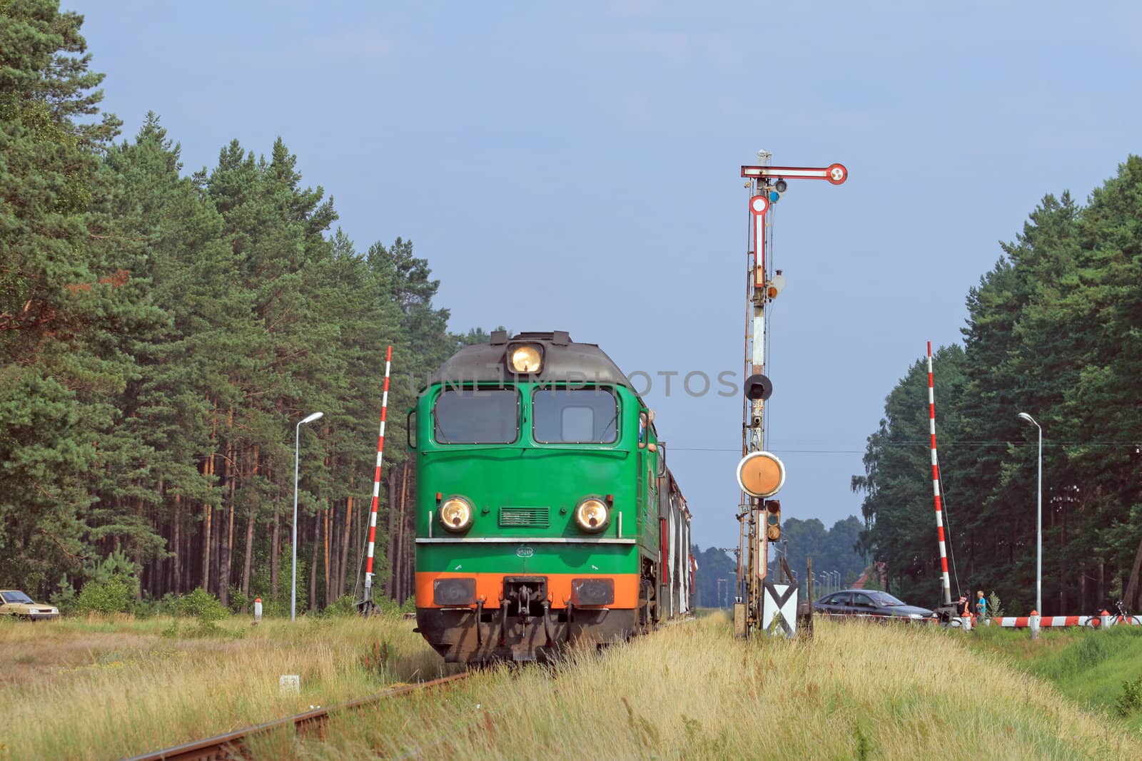 Passenger train passing through polish countryside
