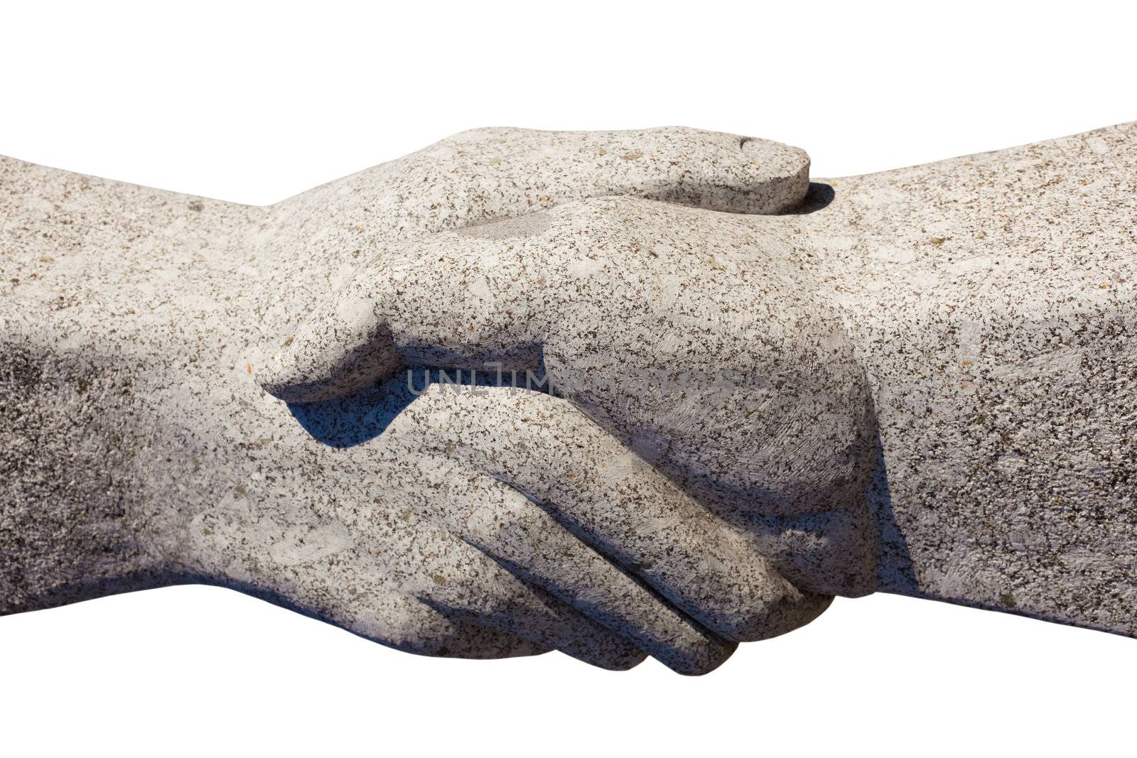Granite sculpture of shaking hands isolated on white background.