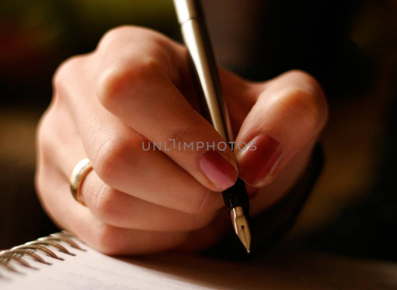 Young female is writing notes