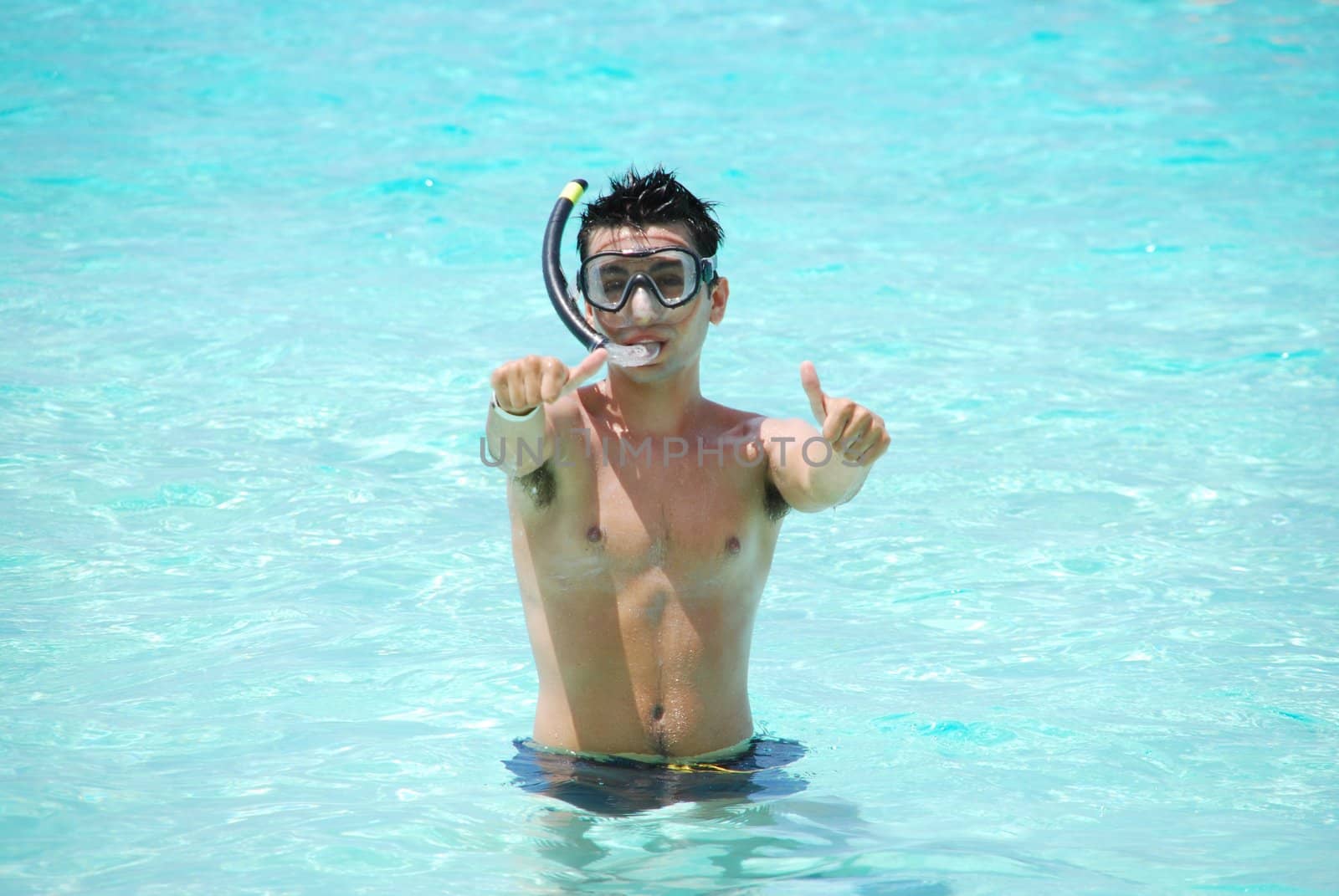 man excited with thumbs up for snorkeling adventure in Maldives