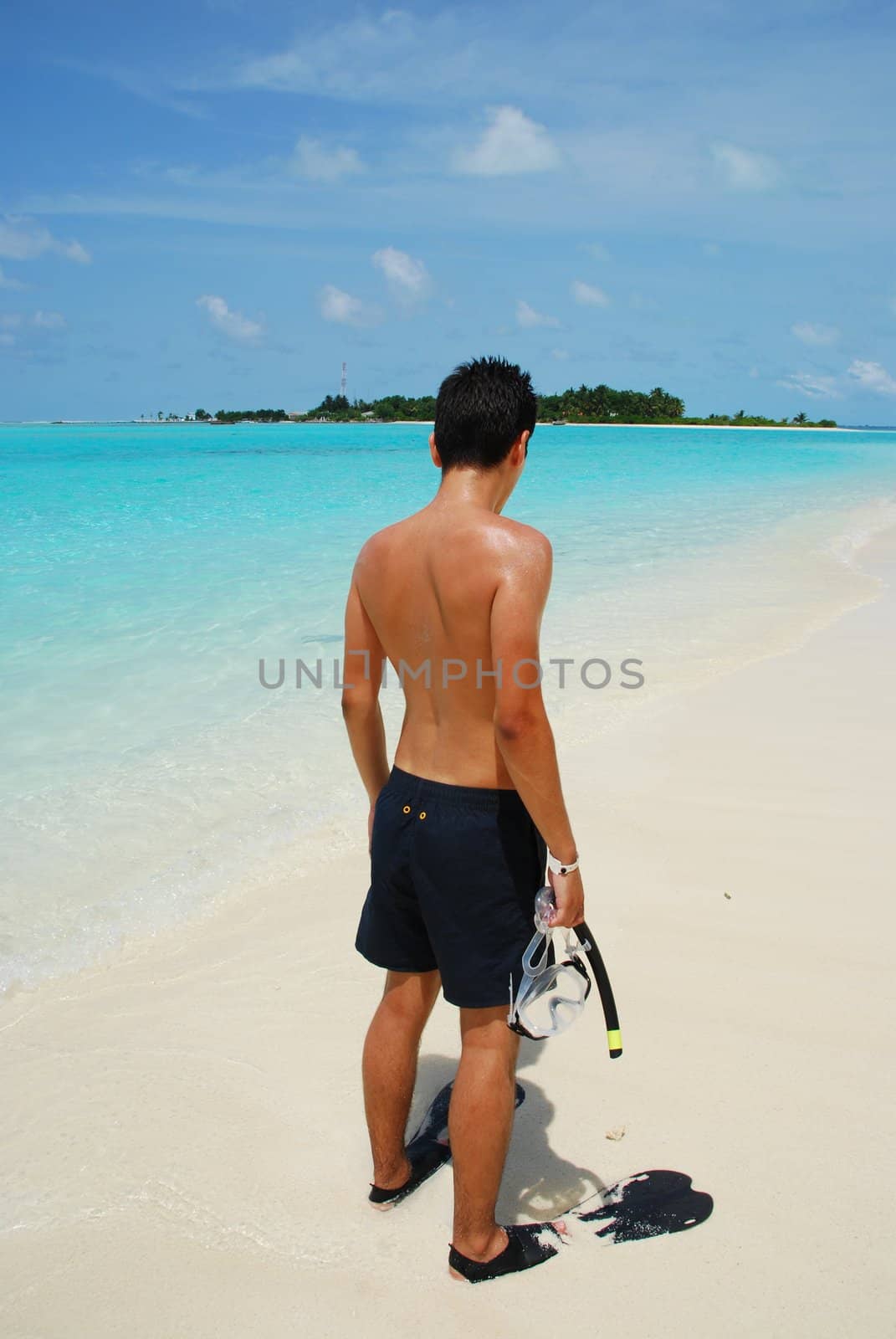 Young man ready to go snorkeling by luissantos84
