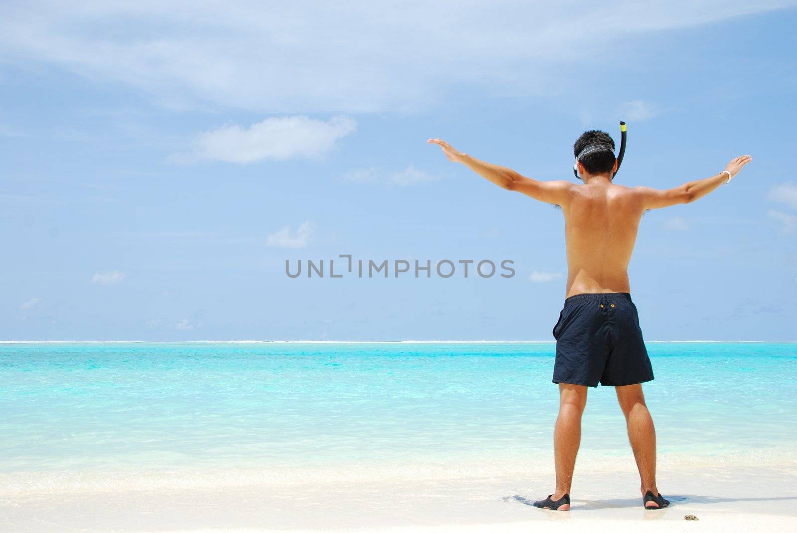 Young man ready to go snorkeling (wide open arms) by luissantos84