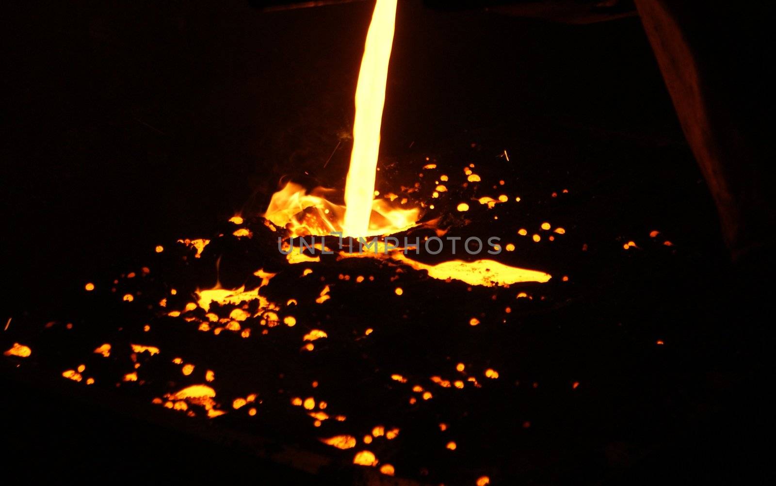 A metal casting into a form on a foundry