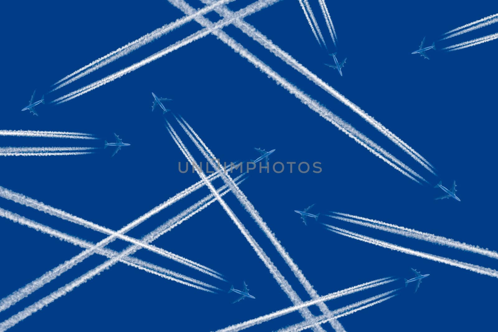 Heavy traffic: airliners criss-crossing the blue sky.