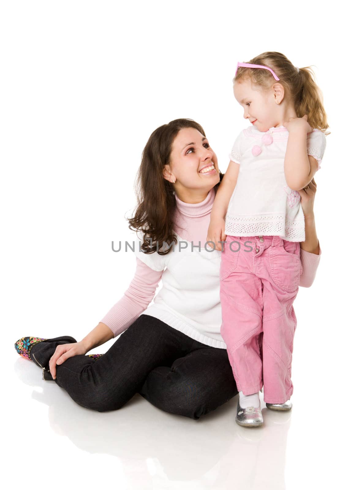 mother and daughter posing together  isolated on white