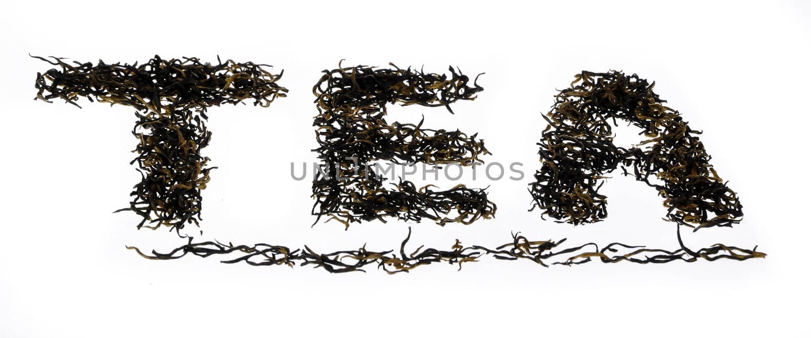 The word tea written using black oolong tea from china on isolated background
