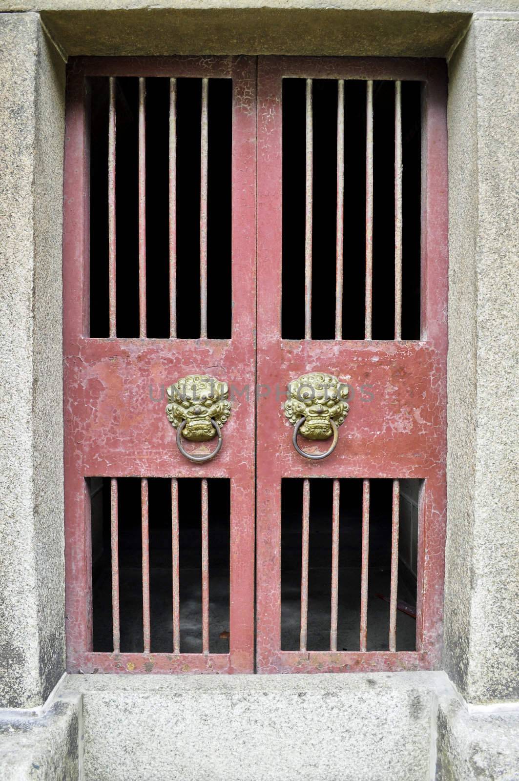 Asian knockers on a traditional style chinese door frame