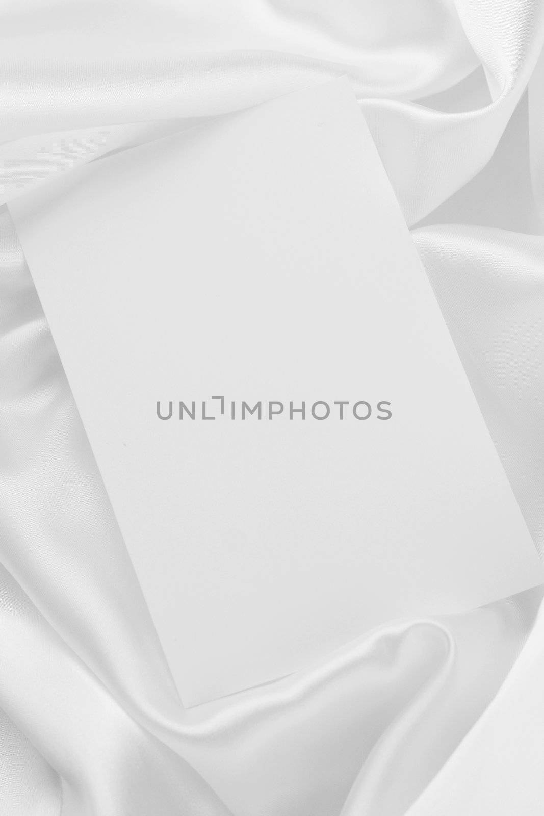 White card on white satin by jarenwicklund